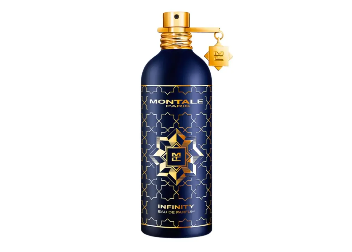 Granatowa butelka perfum Montale Infinity z złotymi zdobieniami i zawieszką.